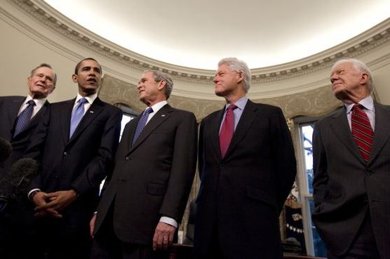 Photograph of President George W. Bush, center, hosts President-elect Barack Obama and former presidents, from left, George H.W. Bush, Bill Clinton and Jimmy Carter in the Oval Office of the White House, 13 days before Mr. Obama’s inauguration. by J. Scott Applewhite